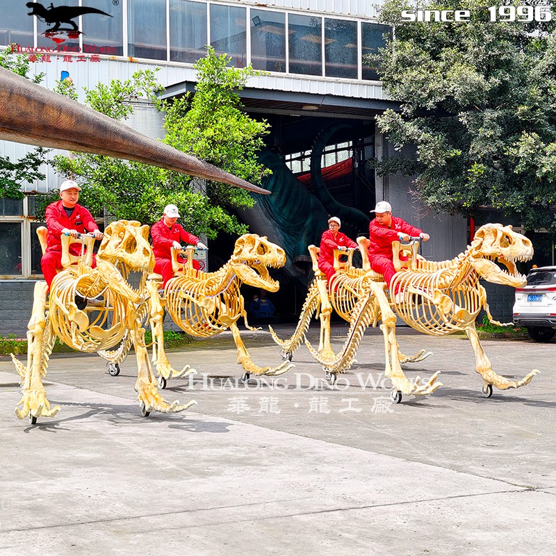 华龙艺术  仿真霸王龙骨架骑乘车 电动滑行恐龙骨架游乐车 商场景区亲子互动打卡道具厂家定制
